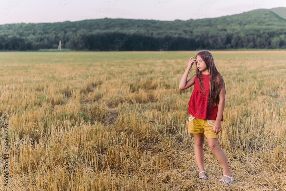 Side view portrait of happy beautiful girl breathing fresh air in field, outdoors. High quality photo Side view portrait of happy beautiful girl breathing fresh air in field, outdoors. High quality photo