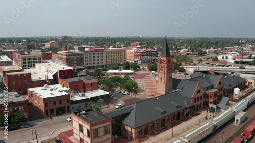 Aerial footage moving past the Train Depot with downtown Cheyenne in the background photo