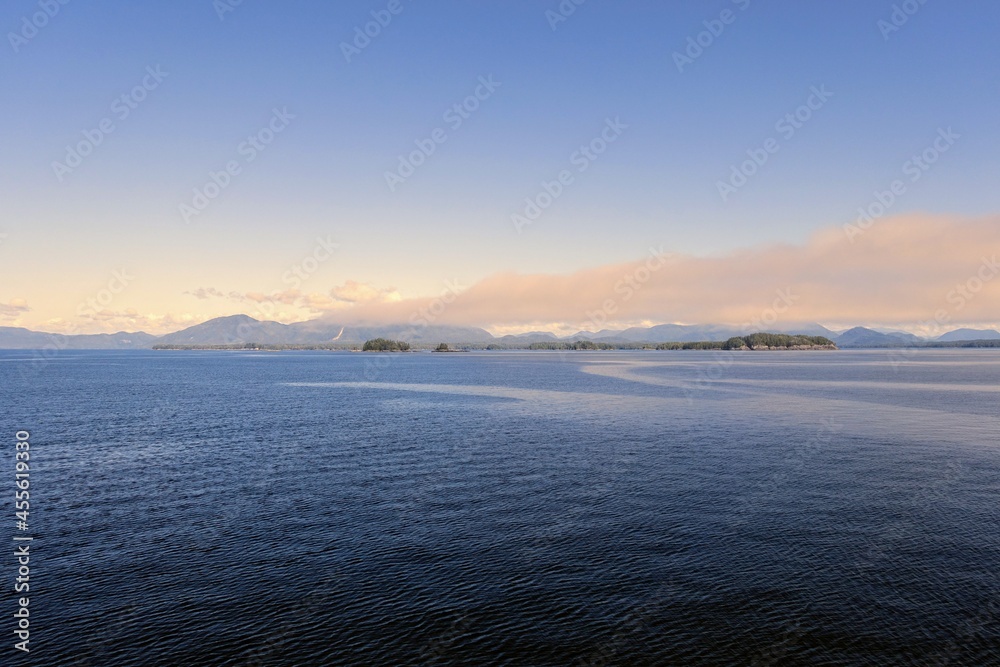 A beautiful photo of a vast ocean and islands in the distance - views along the inside passage BC ferry ride up the west coast of british columbia.