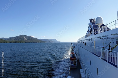 A view of the beautiful seascape and landscape looking at the scenery on the inside passage BC ferry with amazing scenic views of blue ocean and endless forest along the west coast of British Columbia photo