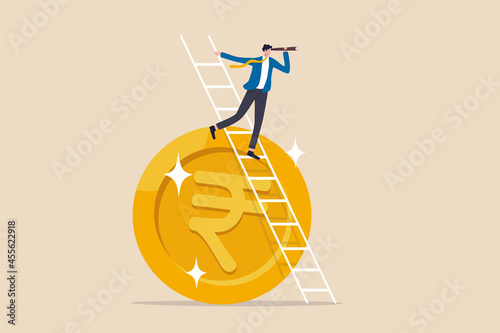 India economic or financial vision, investment and stock market forecast or business profit concept, smart businessman leader climb up ladder on Indian rupee money coin with telescope look for vision.