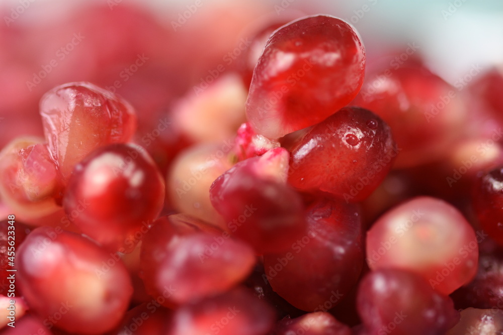 Sweet ripe pomegranate seeds in a porcelain plate Sweet ripe pomegranate seeds in a porcelain plate