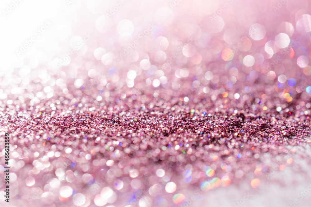 Abstract sequin background with shining festive bokeh.