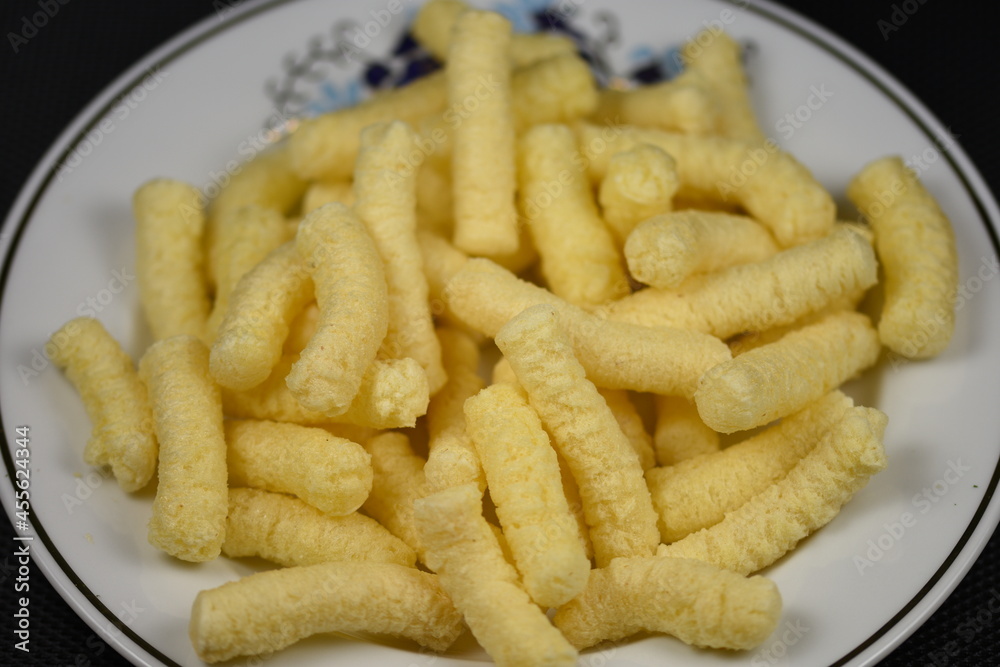 Crunchy, salty corn puffs snacks, also known in Romanian as pufuleti, Crunchy, salty corn puffs snacks, also known in Romanian as pufuleti,