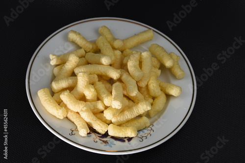 Crunchy, salty corn puffs snacks, also known in Romanian as pufuleti, 