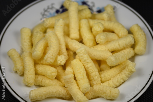 Crunchy, salty corn puffs snacks, also known in Romanian as pufuleti, 