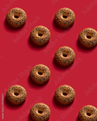 Pattern with bagles on a red background