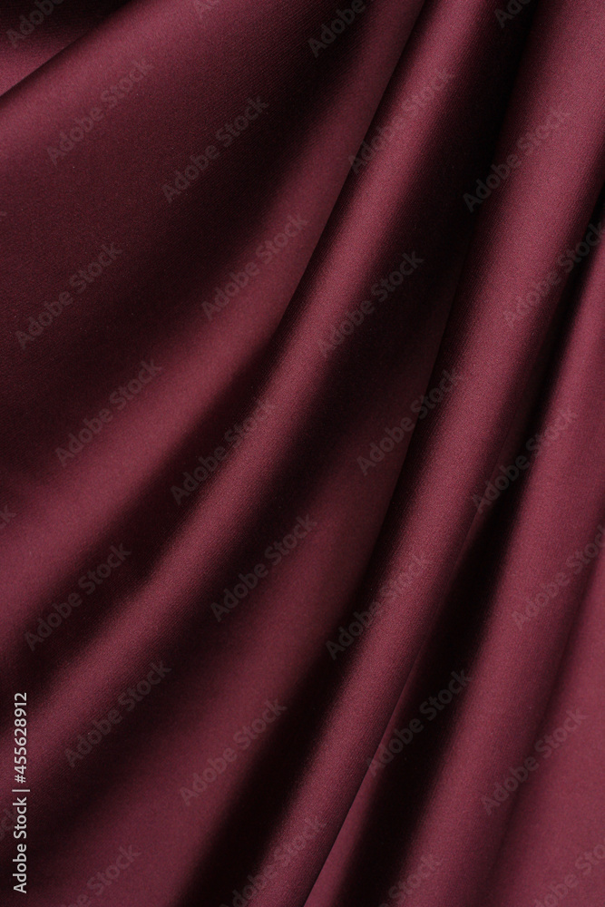 Obraz premium Draped vinous silk fabric background