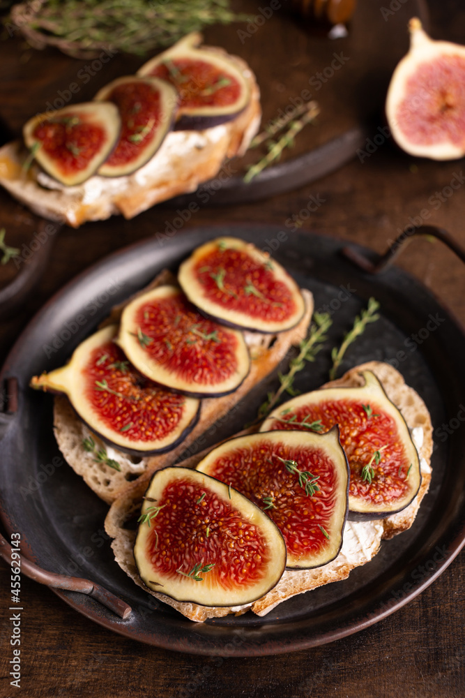 Sweet bruschetta with cream cheese and figs for breakfast Sweet bruschetta with cream cheese and figs for breakfast