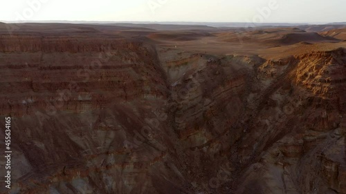 Aerial Panning People Exploring Top Of Mountain During Vacation - Shaharut, Israel photo