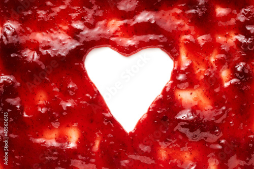 Heart shaped frame surround on white in red berry jam