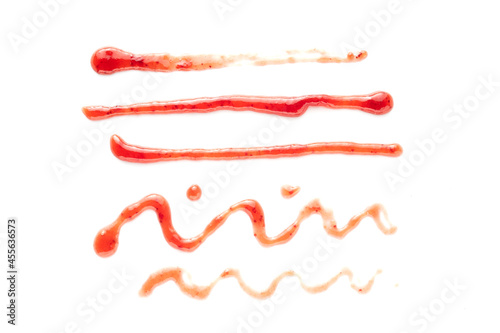 Selection of lines and squiggles drawn in red jam