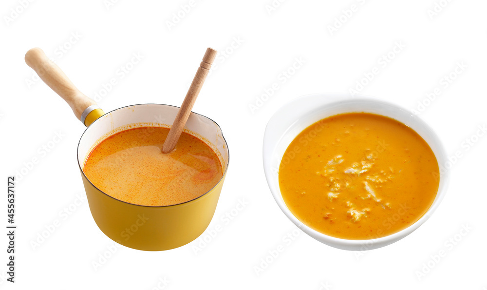 group of red curry in enamel pot and cup on white background group of red curry in enamel pot and cup on white background