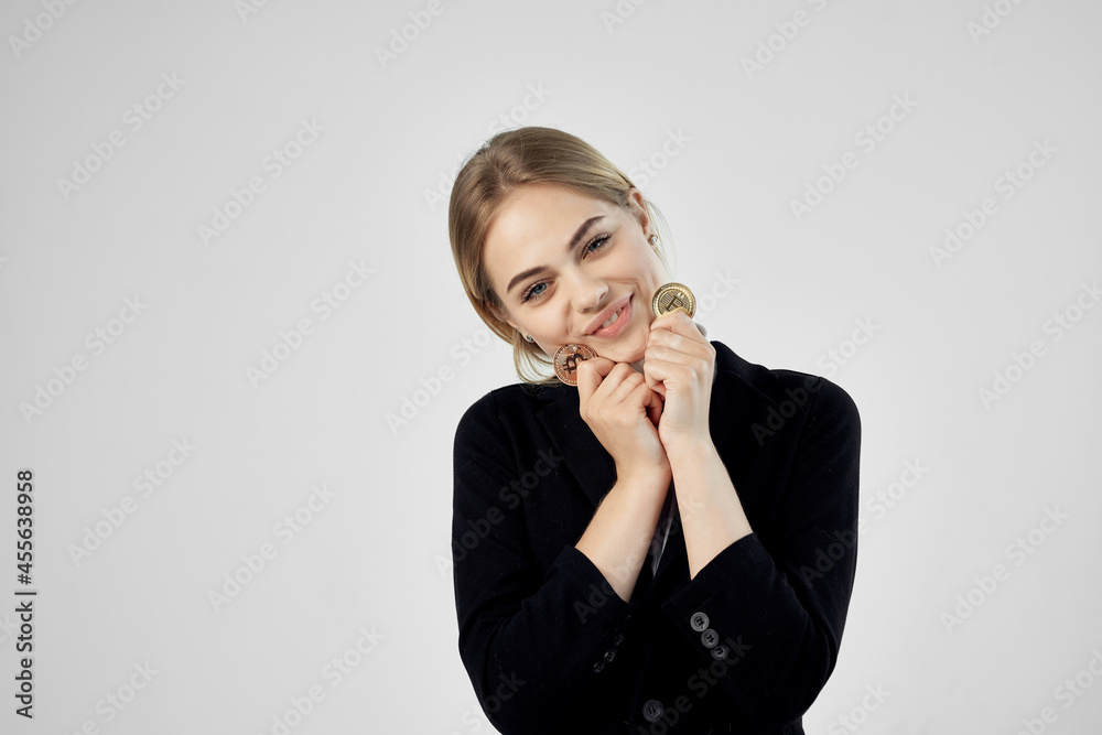 financier Bitcoin cryptocurrency in hands light background