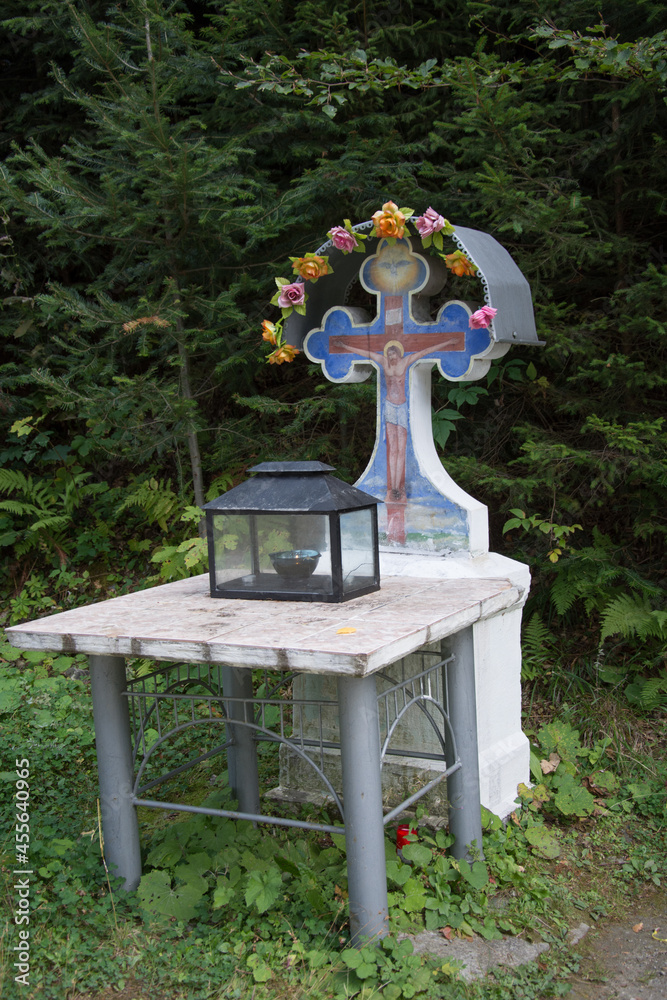 cross and candle near the road at Monastery St. John Iacob Pojorata, Suceava , Romania,2017 cross and candle near the road at Monastery St. John Iacob Pojorata, Suceava , Romania,2017