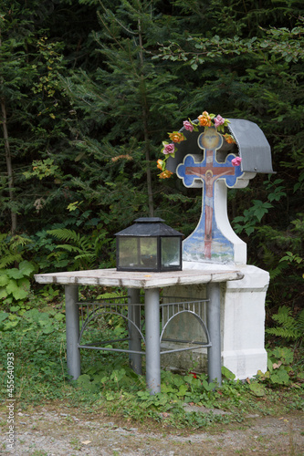 cross and candle near the road at Monastery St. John Iacob  Pojorata, Suceava , Romania,2017 photo