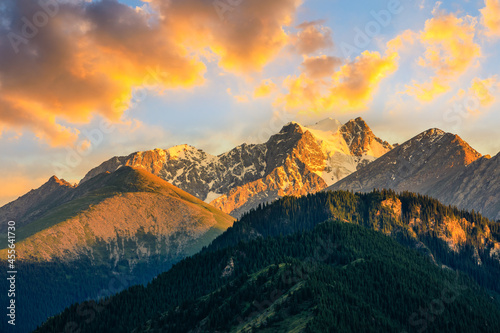 Beautiful mountain and colorful clouds natural landscape at sunset in Xinjiang,China. © ABCDstock