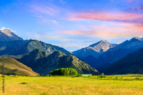 Beautiful mountain and colorful clouds natural landscape at sunset in Xinjiang,China. © ABCDstock