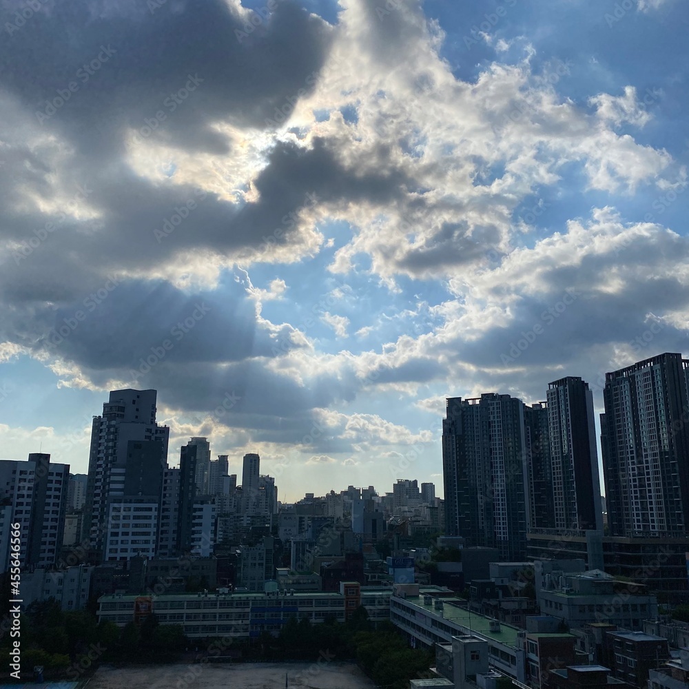 clouds over city skyline