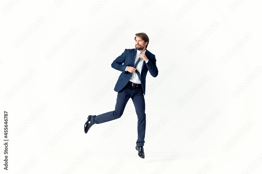 man in a suit emotions successful light background