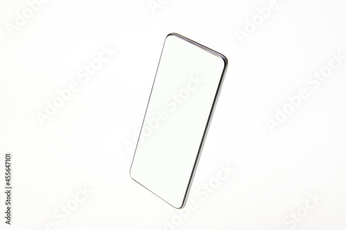 Mobile phone with blank screen on white background