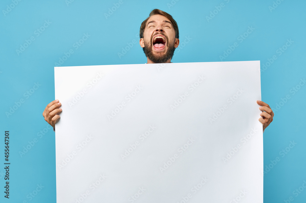bearded man white banner in hand blank sheet presentation blue background bearded man white banner in hand blank sheet presentation blue background