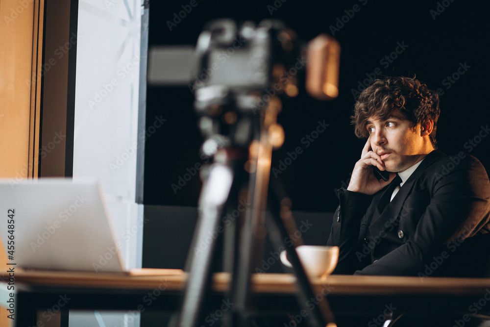 Handsome young blogger at a recording station