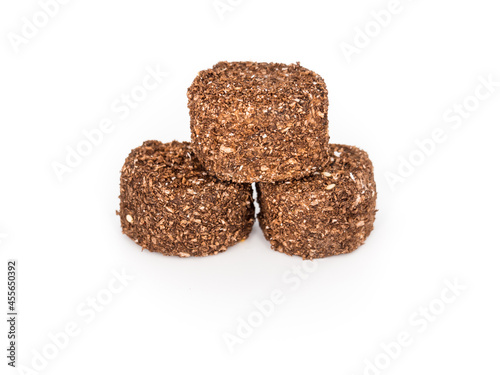 Brown Turkish delight with cocoa on a white background. Isolated. Horizontally
