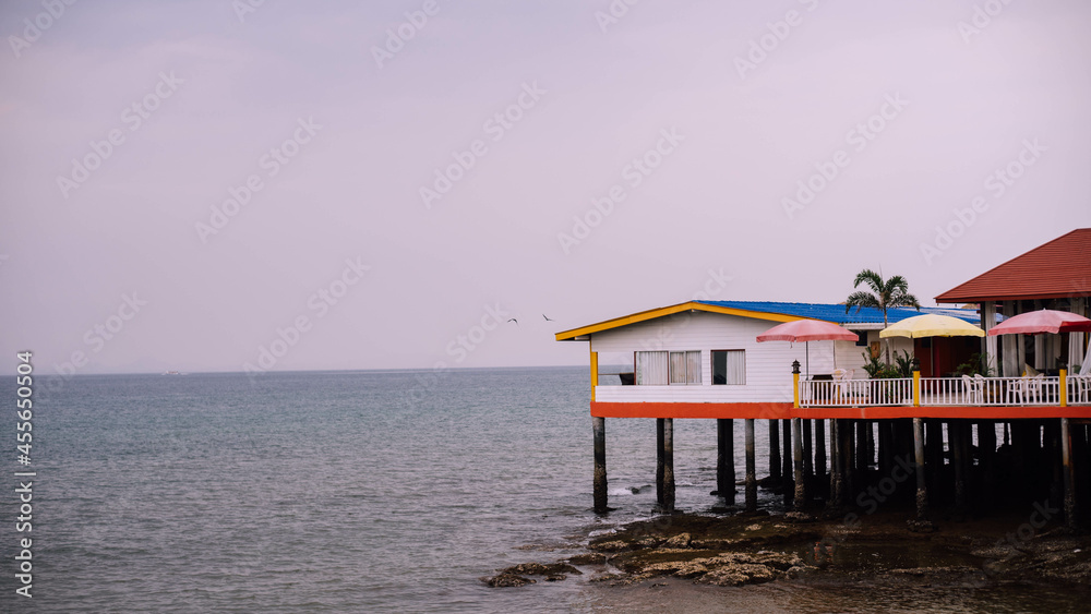 Fototapeta premium house by the sea on stilts in tailand 