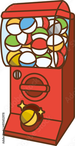 Red capsule toy machine viewed from an angle.