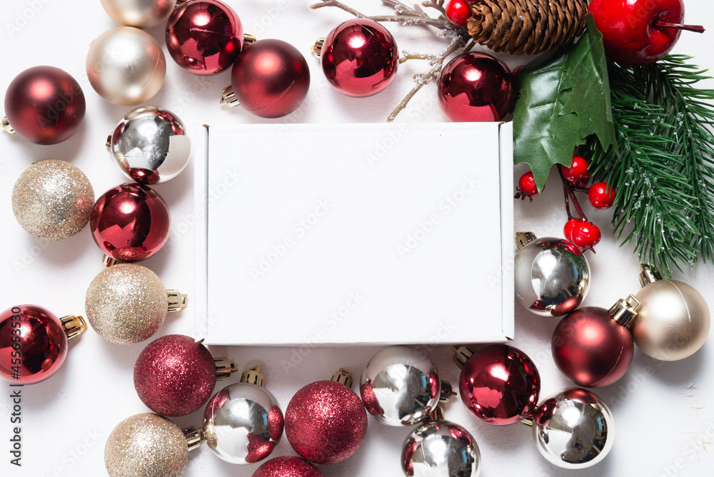 Brown cardboard mailer box decorated with Christmas ornaments Brown cardboard mailer box decorated with Christmas ornaments