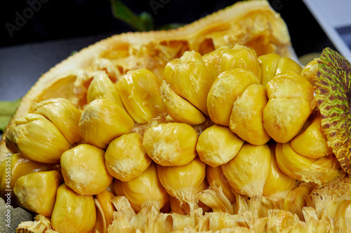 organic ripe chempedak fruit peeling to eat on table photo