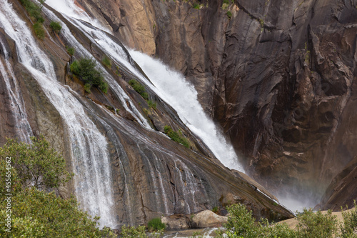 Waterfall of a river over a lake