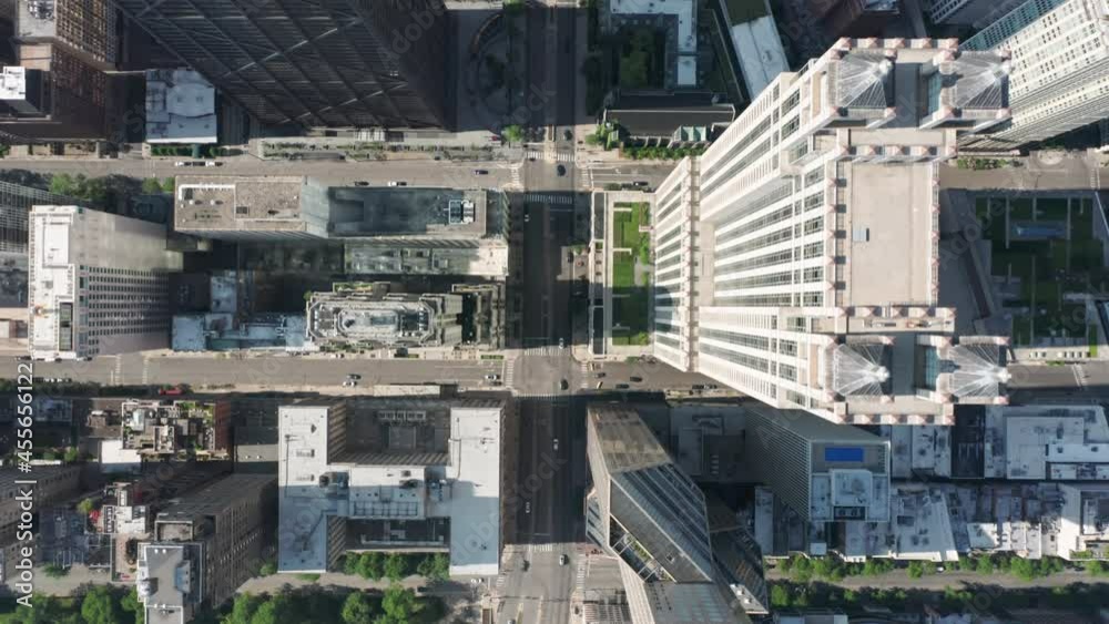 Top down aerial view of tall buildings and city streets in Chicago City, Illinois USA. Busy urban traffic, city transportation in financial district. Shot on 4K drone camera, helicopter view footage. Top down aerial view of tall buildings and city streets in Chicago City, Illinois USA. Busy urban traffic, city transportation in financial district. Shot on 4K drone camera, helicopter view footage.