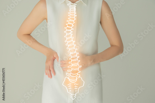 Woman in white clothes, handrawn human Spine, healthcare service concept stock photo