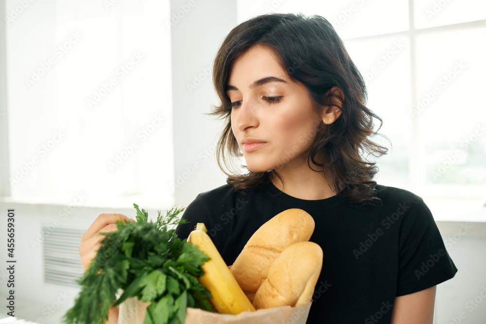 woman in the kitchen package with groceries cooking food delivery health woman in the kitchen package with groceries cooking food delivery health