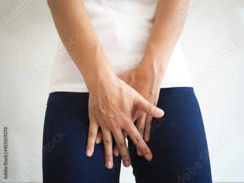 A woman has an inguinal hernia. concept of health and medicine. closeup photo, blurred. photo