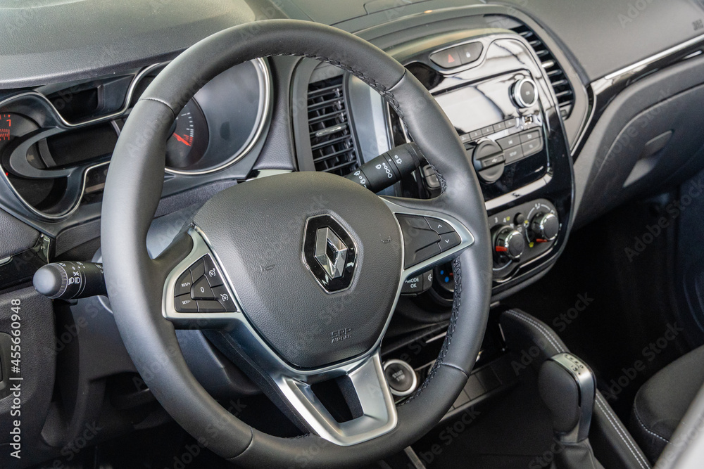 Steering wheel in interior of Renault Captur SUV. Closeup of steering