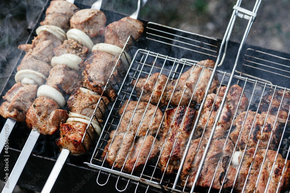 The meat is grilled on the grill. Shashlik
