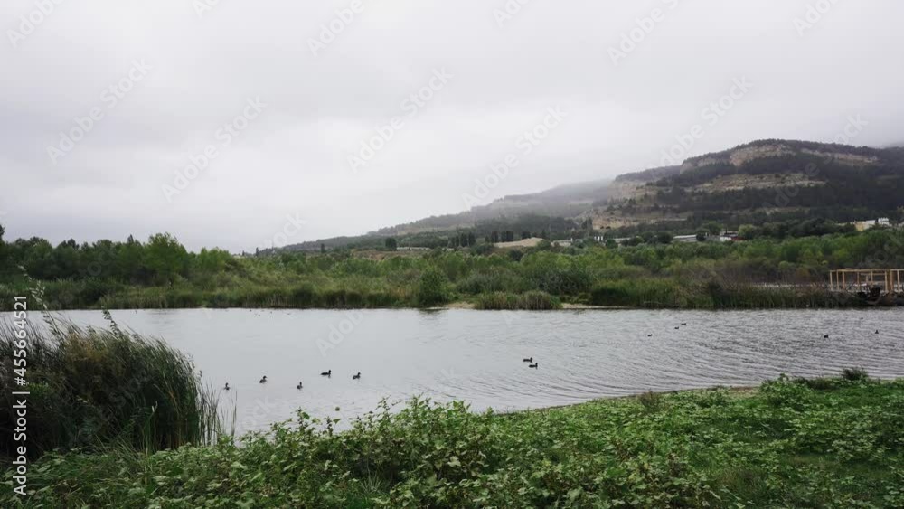 Lake in the mountains in cloudy weather Lake in the mountains in cloudy weather