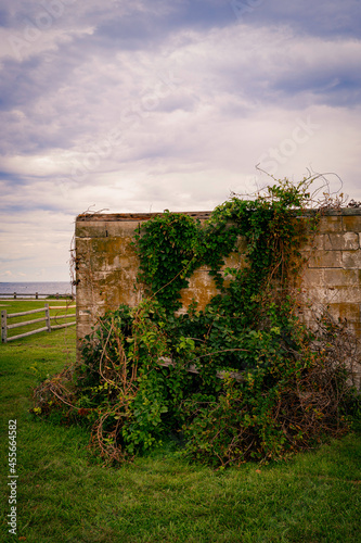 Old ruined remains of housings at the Beavertail State Park Lighthouse in Rhode Island photo