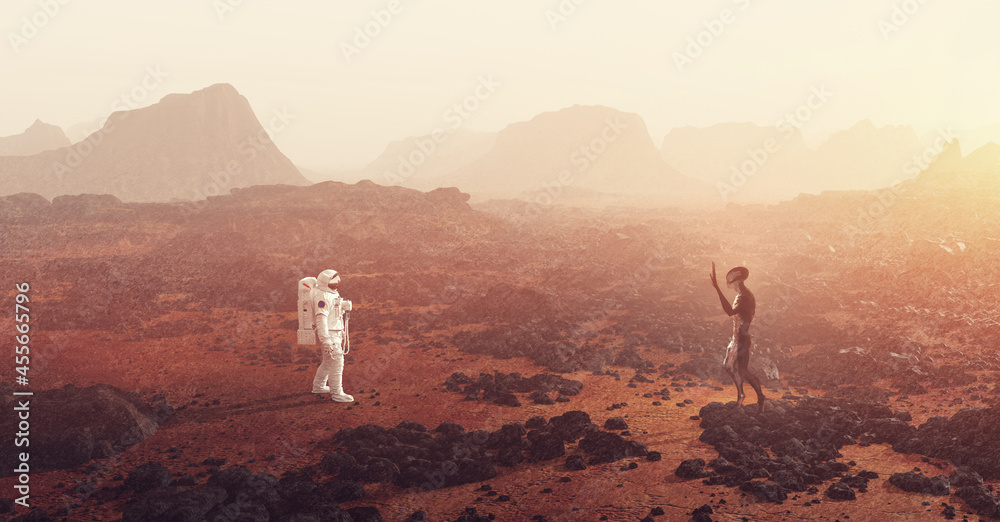 Astronaut meeting an alien on planet such as Mars - obrazy, fototapety, plakaty 