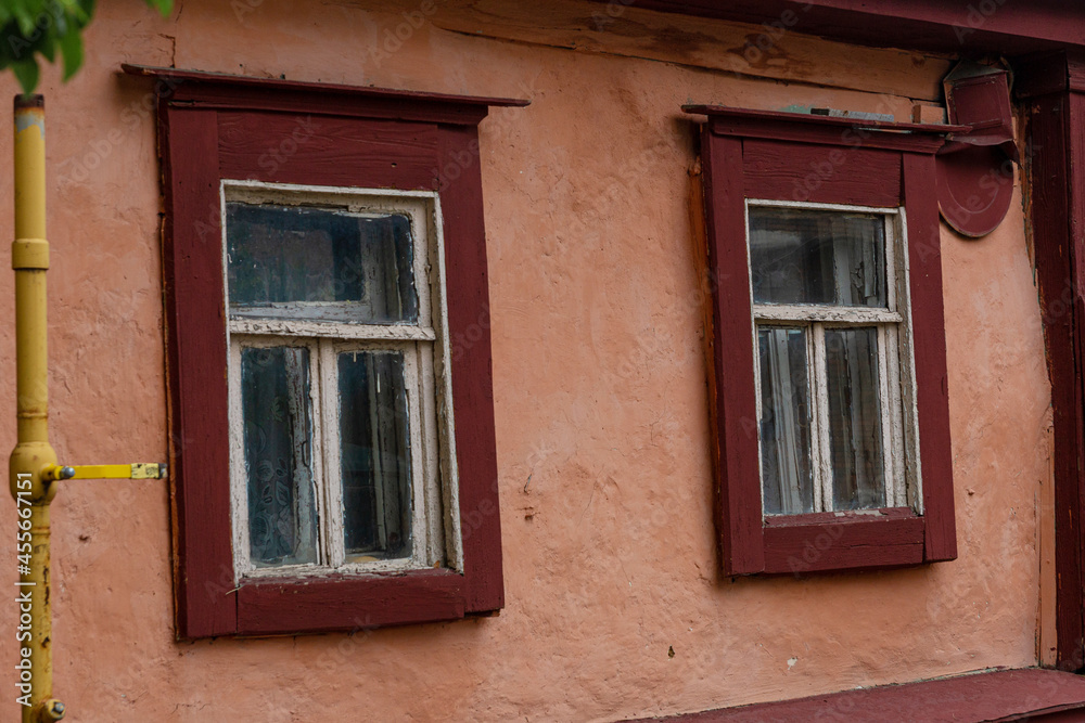 A beautiful old window in a carved wooden frame, Russia, Tula.