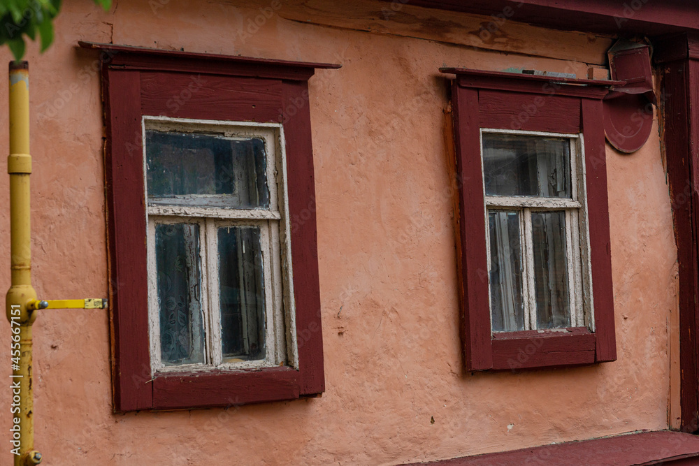 A beautiful old window in a carved wooden frame, Russia, Tula. A beautiful old window in a carved wooden frame, Russia, Tula.