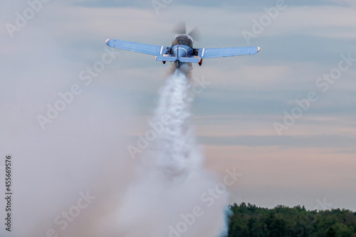 Takeoff of a sports airplane with smoke
