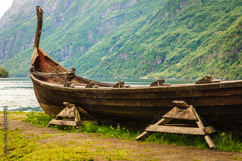 Old wooden viking boat in norwegian nature photo