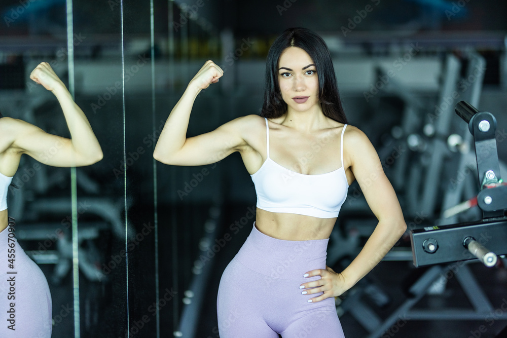 Portrait of fitness girl exercising in gym Portrait of fitness girl exercising in gym