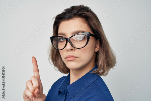 elegant woman wearing glasses blue shirt studio