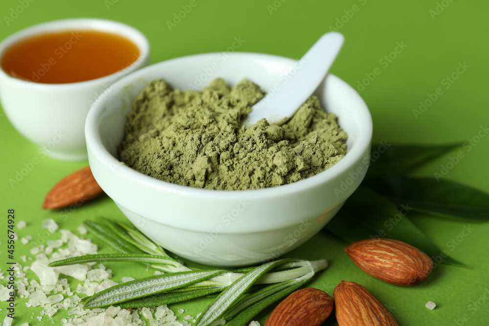 Natural spa cosmetics on green background, close up Natural spa cosmetics on green background, close up