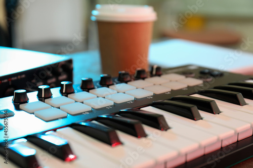 Musician workplace with midi keyboard, close up